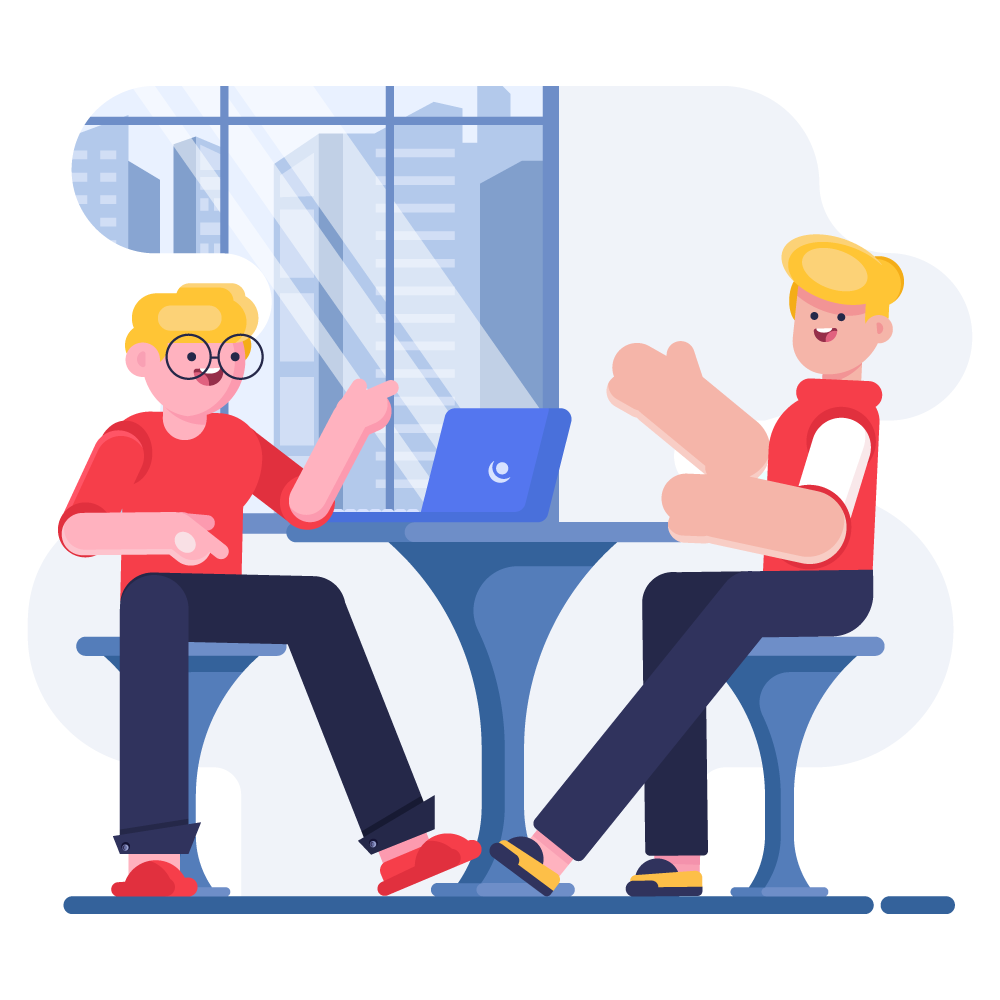 Two people talking across a table with a laptop between them